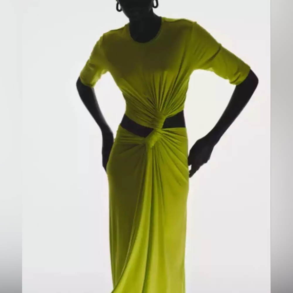 This Front twist dress features sides out and back midi length
